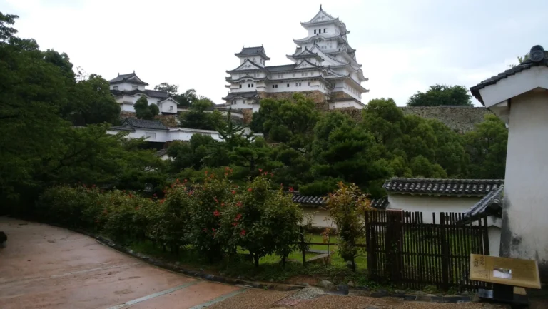Himeji Castle surrounded by lush green trees, an iconic Japanese landmark representing all seasons