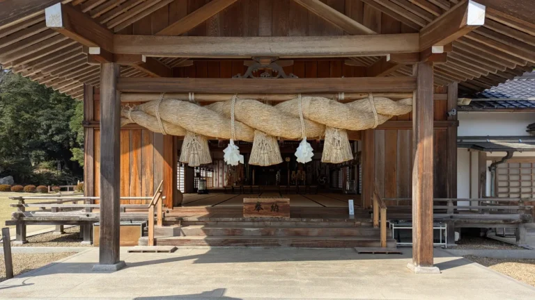 Massive sacred shimenawa rope hanging over the entrance to a hall at Izumo Taisha Shrine in Shimane, Japan.