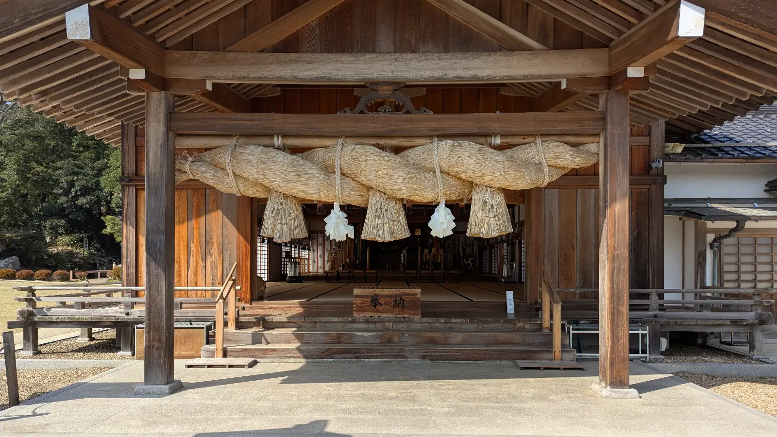 Massive sacred shimenawa rope hanging over the entrance to a hall at Izumo Taisha Shrine in Shimane, Japan.