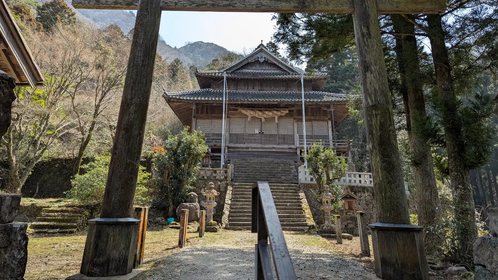 Wooden torii gate framing Sahimeyama Shrine, a sacred mountain site within the Iwami Ginzan Silver Mine area in Shimane