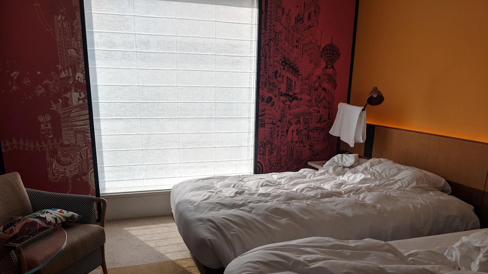 Elegant Kyoto hotel room with warm lighting, modern furnishings, and traditional textures
